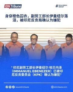 印尼人力部副部长伊曼纽尔·埃比尼泽身穿橙色背心